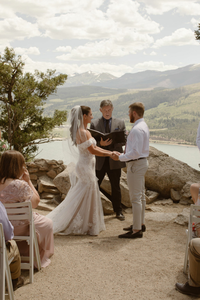 a bride and groom during their elopement ceremony at sapphire point