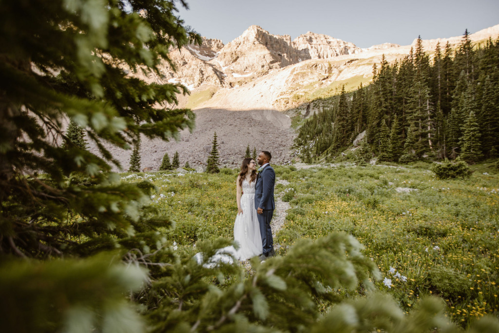 a portrait of bride and groom during their sunrise hiking elopement in telluride