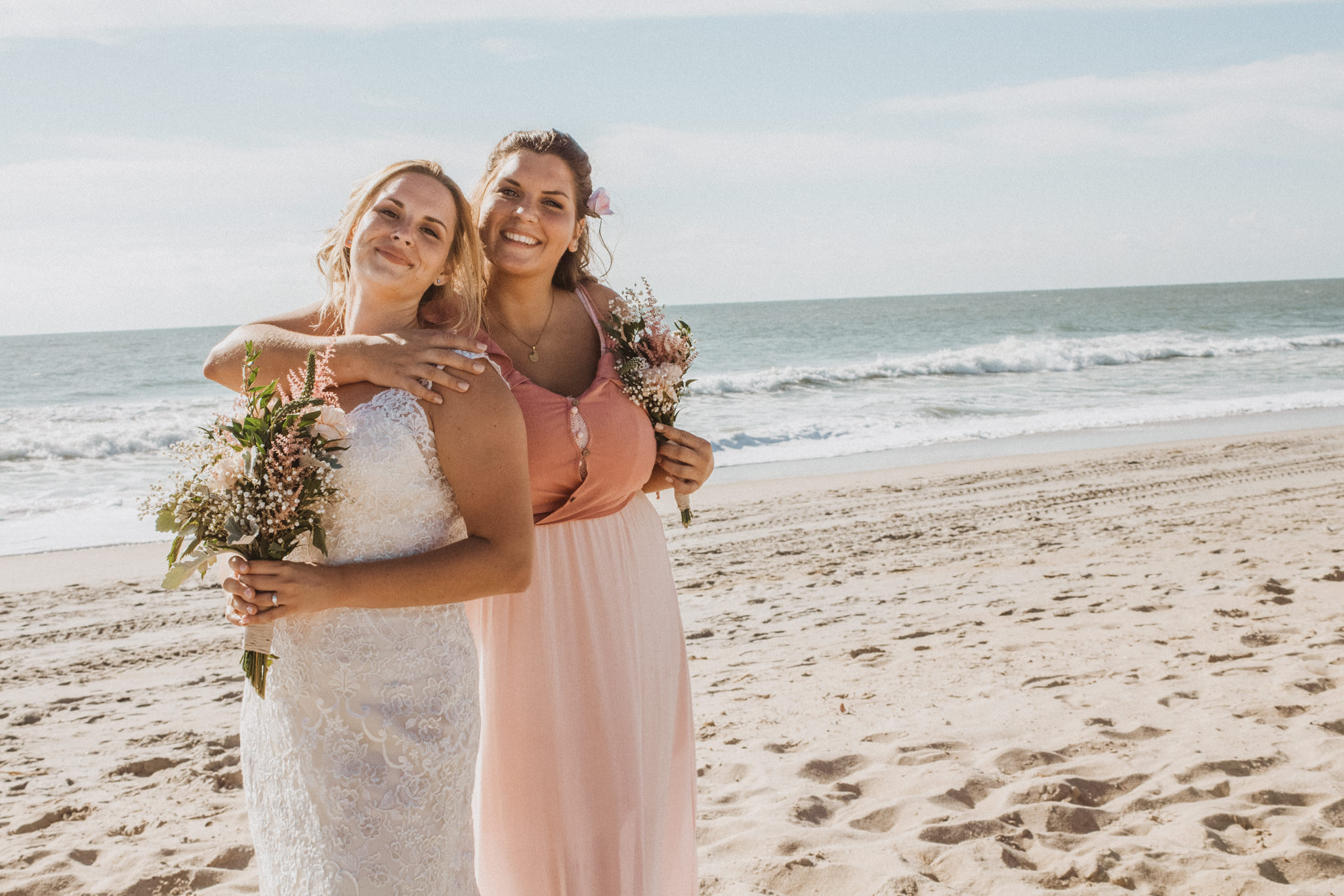 a bride and her maid of honor during a beach elopement